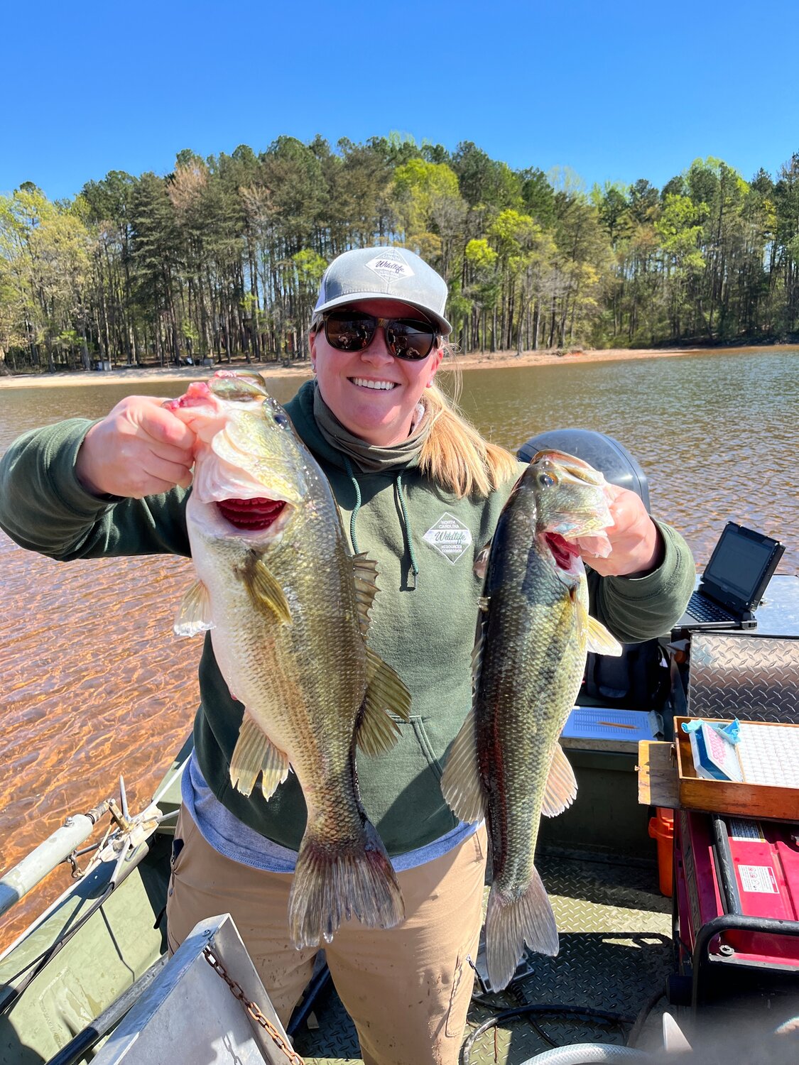 A NCWRC employee showing off some North Carolina-caught bass. Courtesy photo